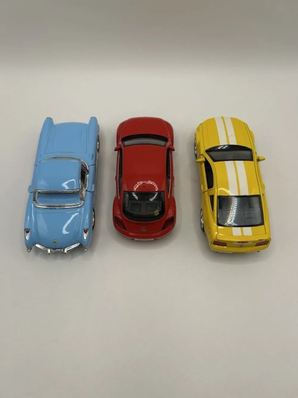 Lot of 3 Diecast Cars Corvette VW Beetle Mustang Kinsmart Scale Blue Red Yellow